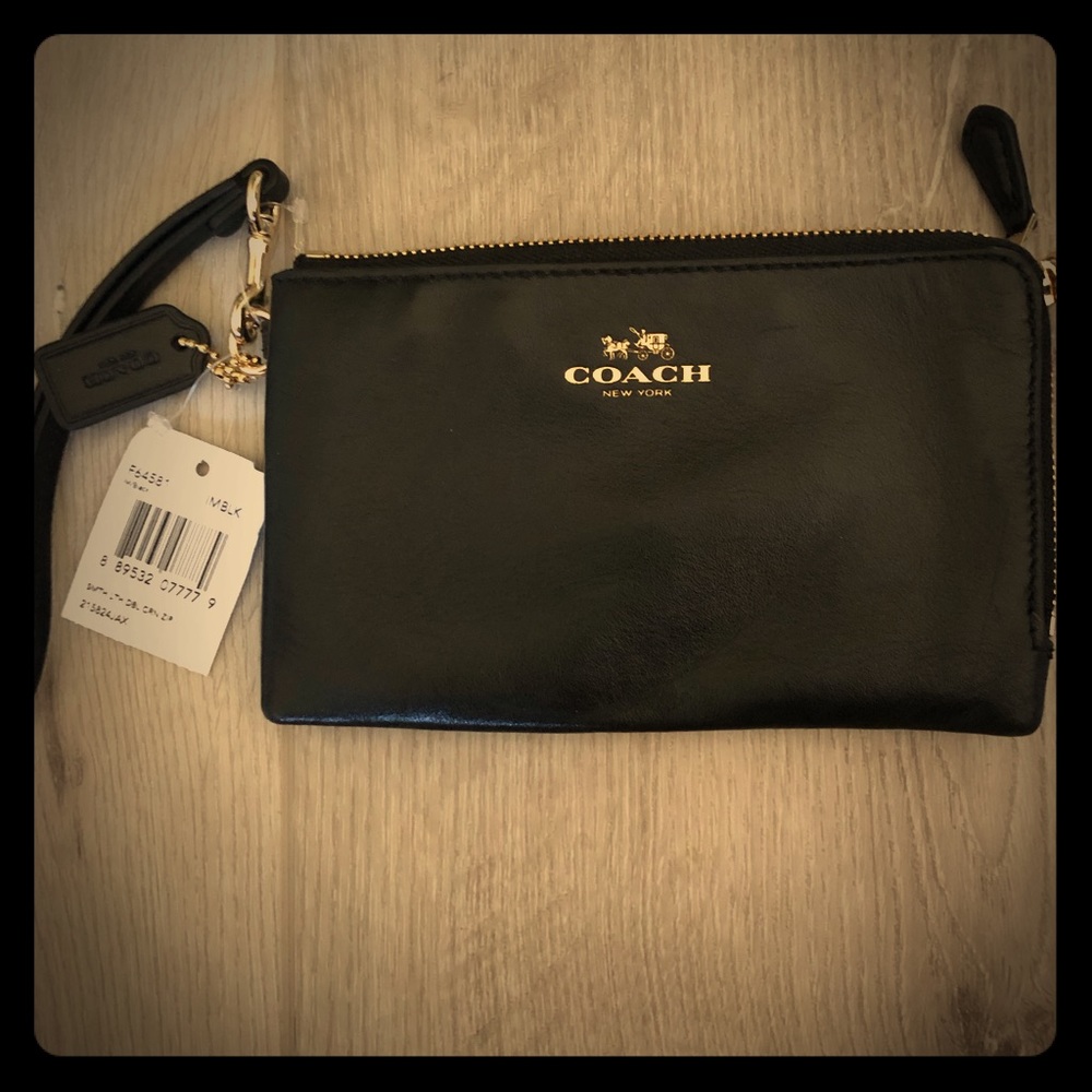 Coach flat emblem wristlet. Black/gold